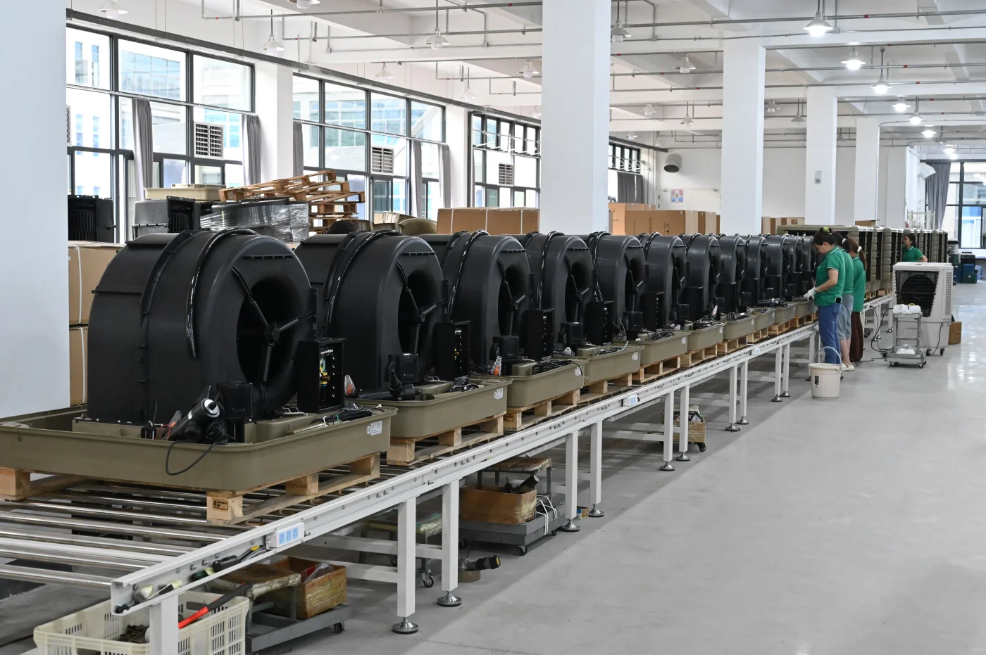 JHCOOL cooler housings and fans on the assembly line